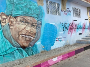 'El Joe Arroyo como representación del desplazamiento forzado'|‘Maicol pintando la Calle del Color junto a Mayerli, una lideresa’|‘Mural de las mujeres representativas de la|‘Mural de la mamá de Maicol’|‘Un campesino con una flauta de pan’|||
